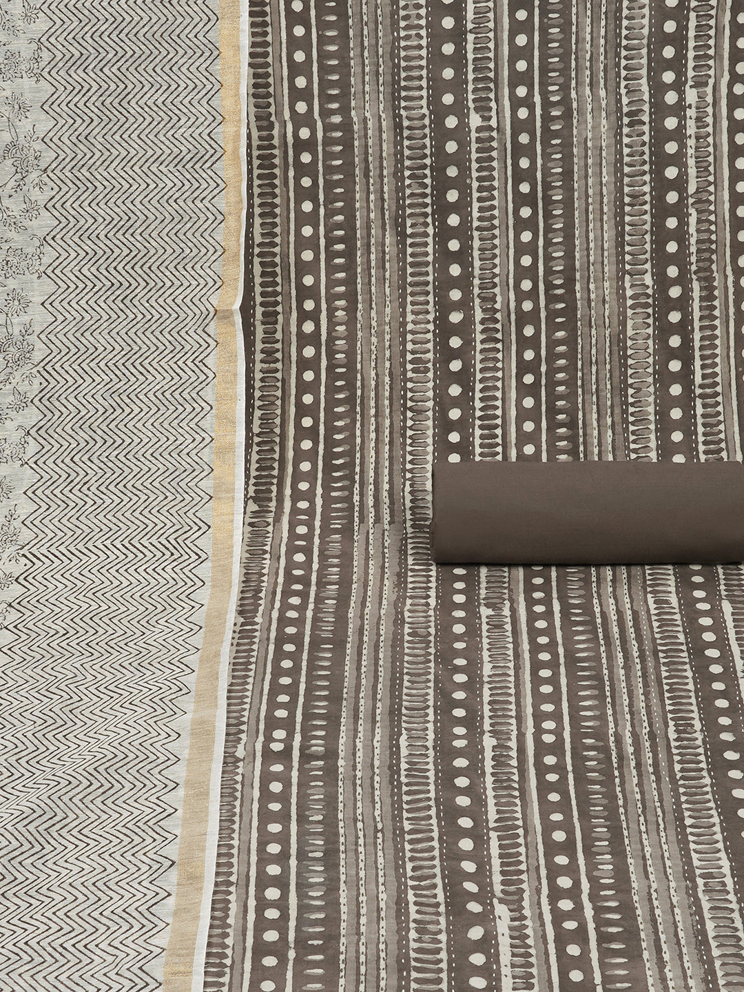 Brown unstitched suit set with traditional geometric dabu print along with printed dupatta and solid bottom