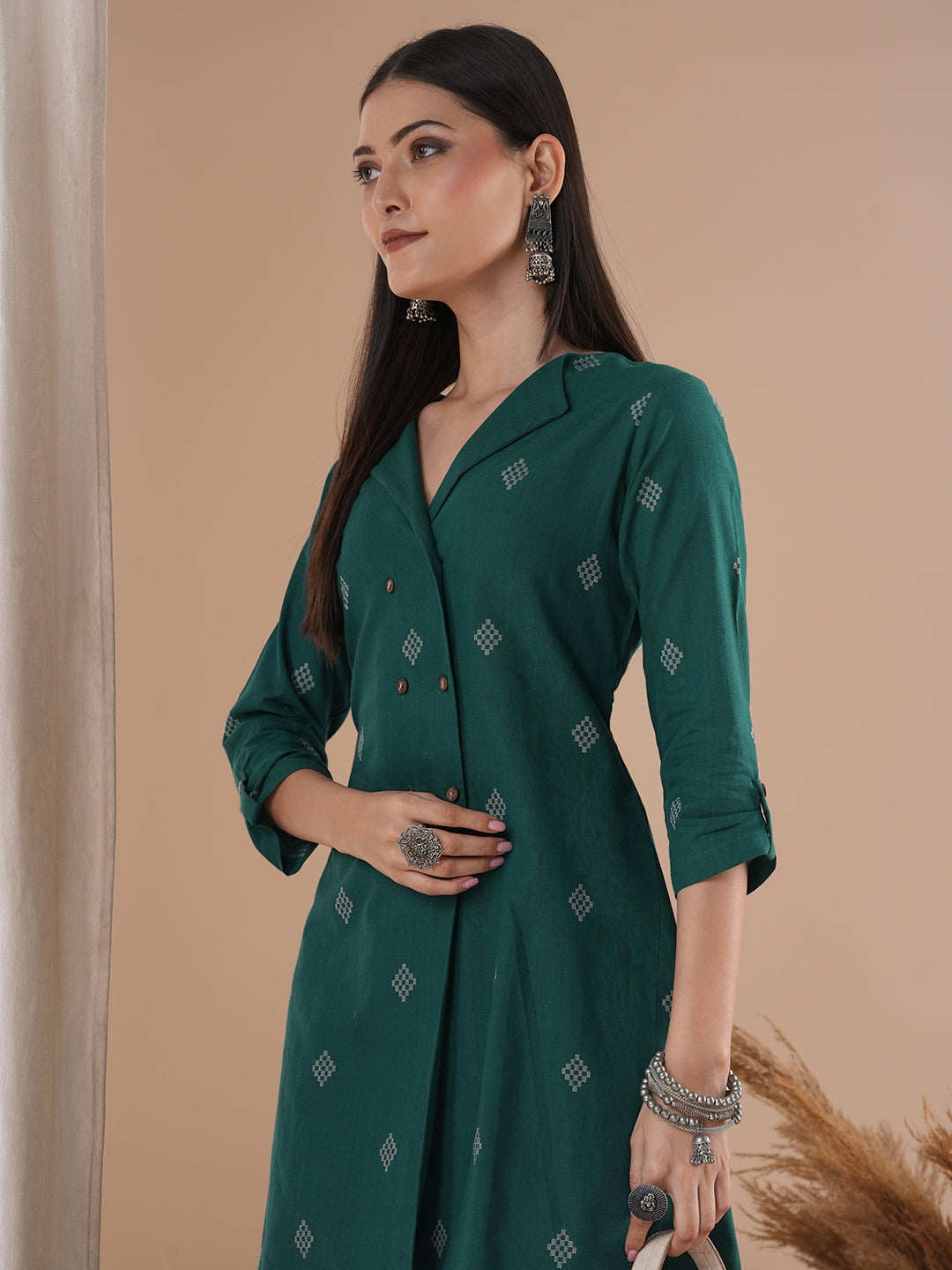 A co-Ord set with a lapel collar top with loop detailing on the sleeves paired with solid palazzos