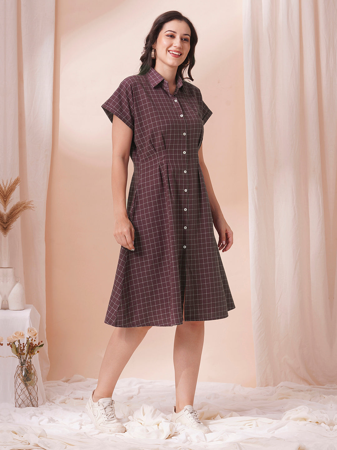 Checkered Fit and Flare dress with extended shoulder sleeve and pocket.