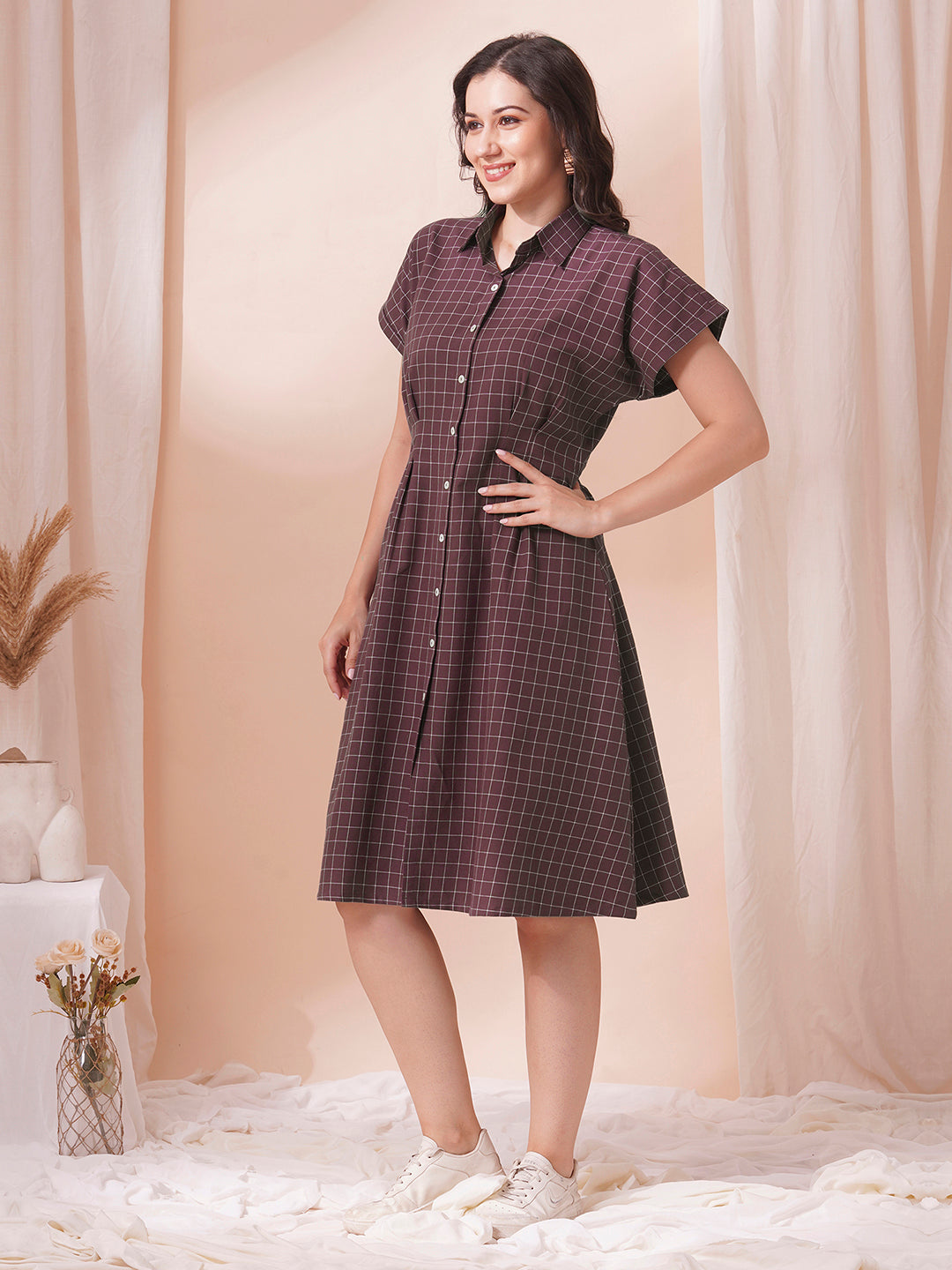 Checkered Fit and Flare dress with extended shoulder sleeve and pocket.