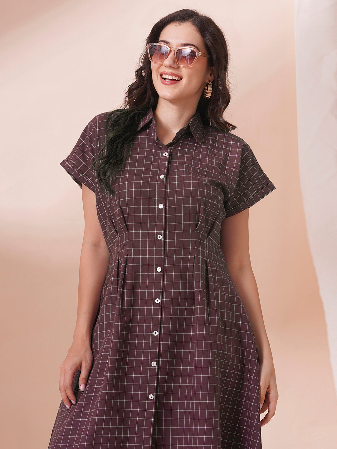 Checkered Fit and Flare dress with extended shoulder sleeve and pocket.