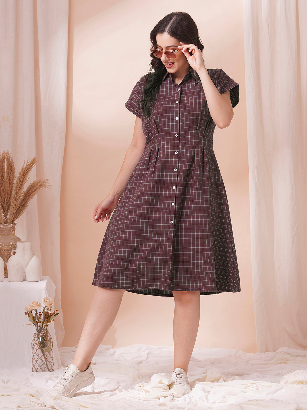 Checkered Fit and Flare dress with extended shoulder sleeve and pocket.