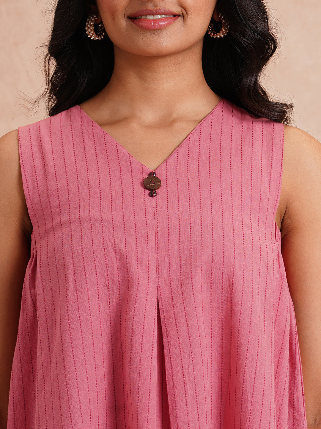 Pocketed dress in woven kantha fabric with elasticated side gathering and block print.