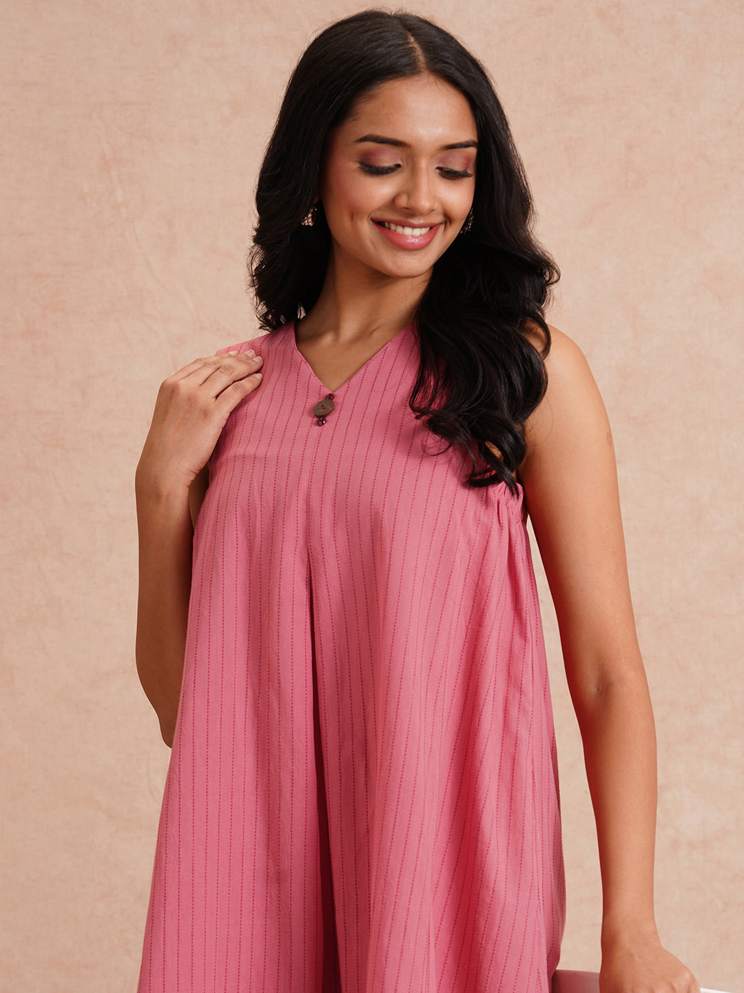 Pocketed dress in woven kantha fabric with elasticated side gathering and block print.