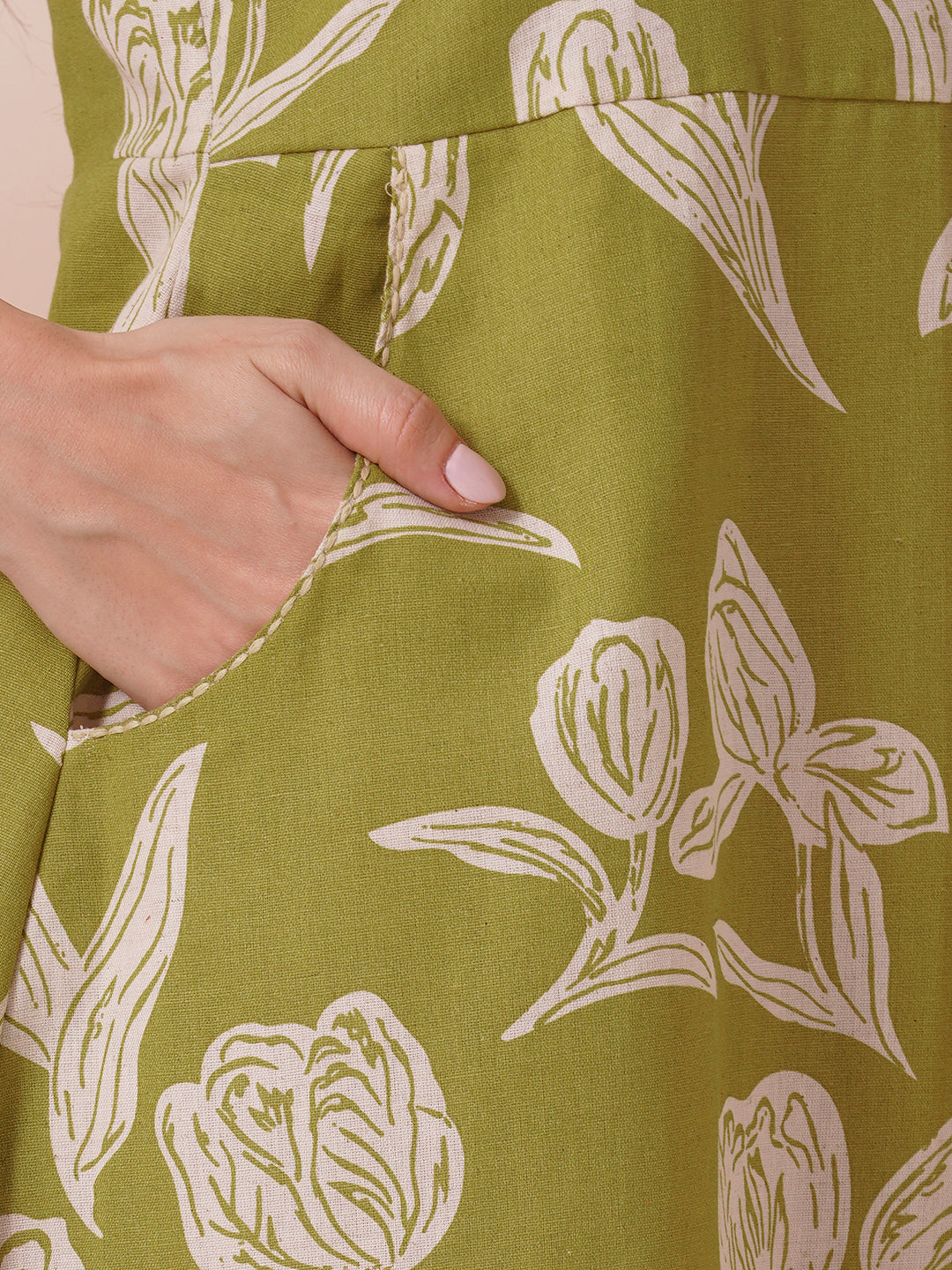 Fit and flare halter neck dress in printed cotton flex with double pockets.