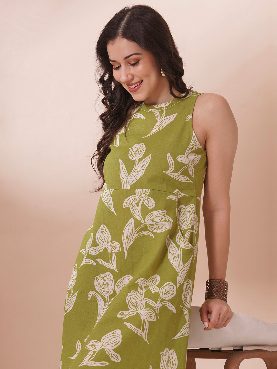 Fit and flare halter neck dress in printed cotton flex with double pockets.