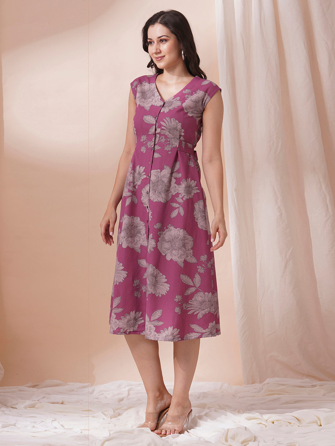 Printed flex extended shoulder dress with functional centre placket and waist tie-up.
