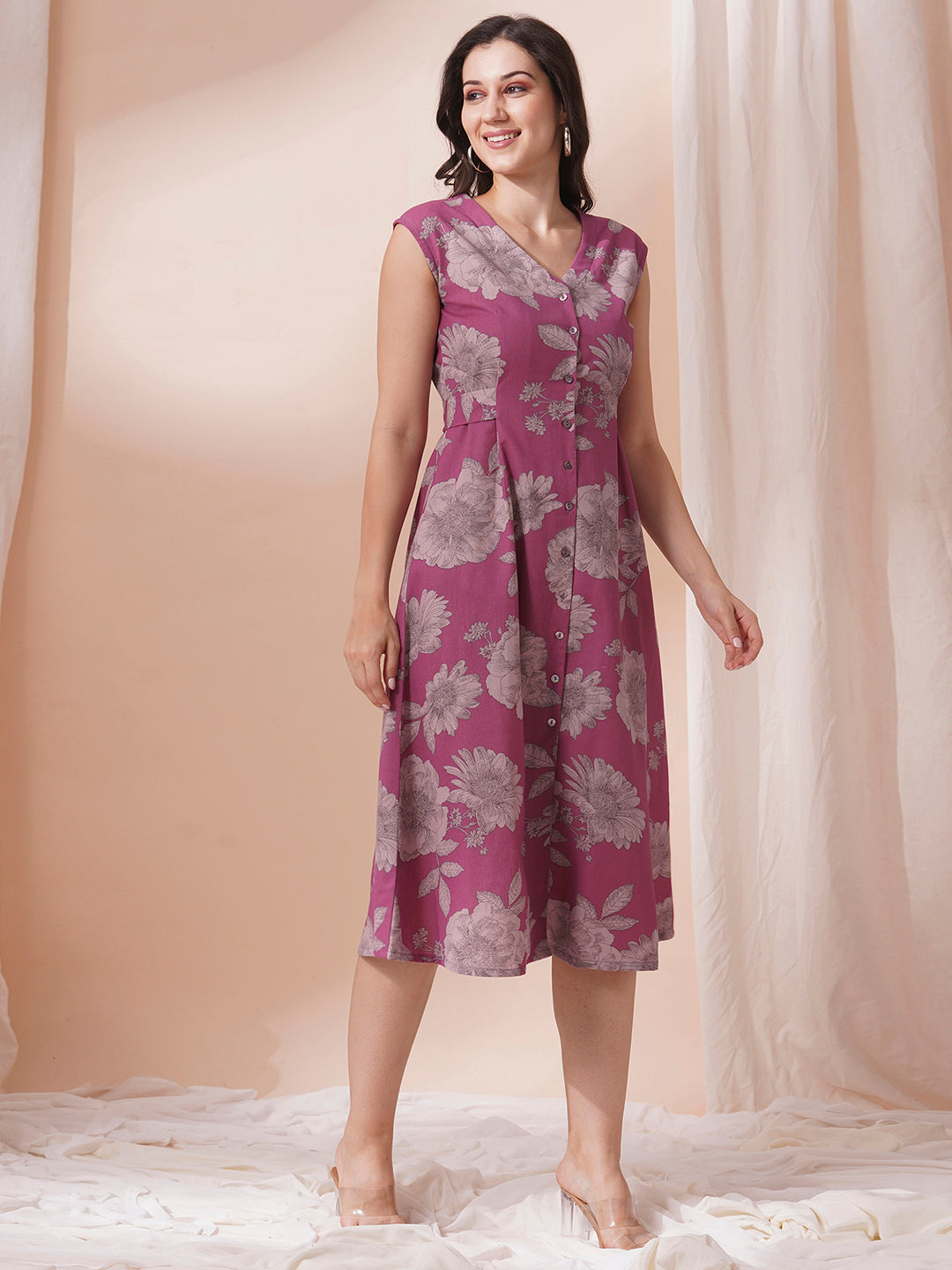 Printed flex extended shoulder dress with functional centre placket and waist tie-up.