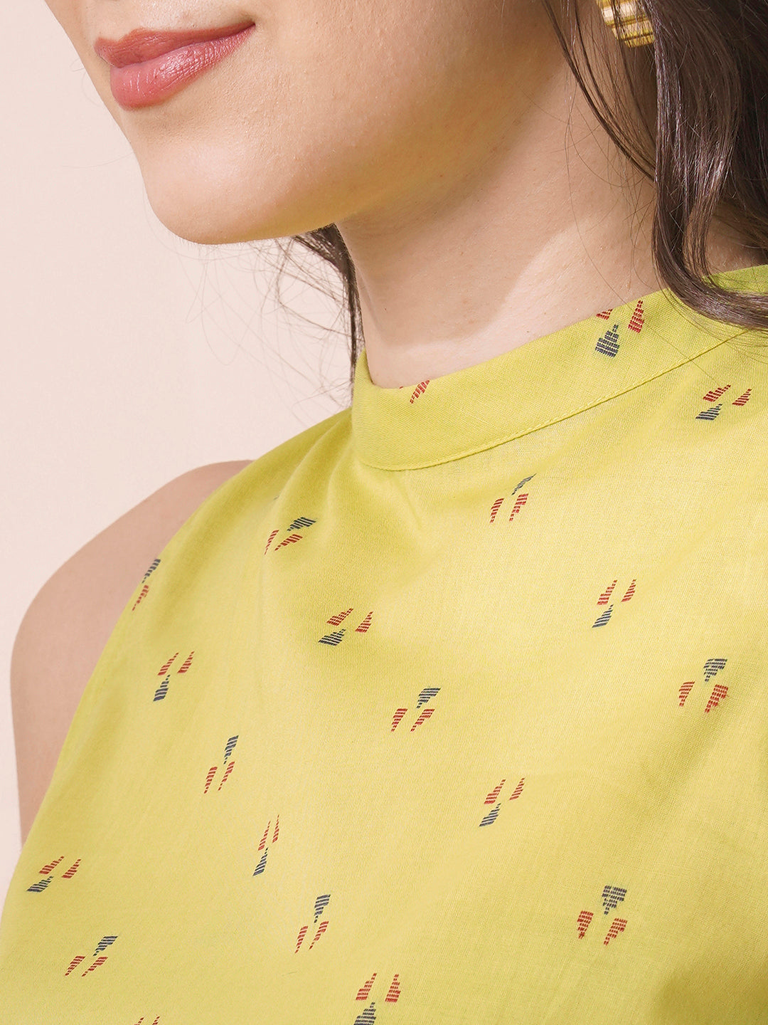 Gathered tiered sleeveless dress with back neck tie-up detailing on dobby fabric.