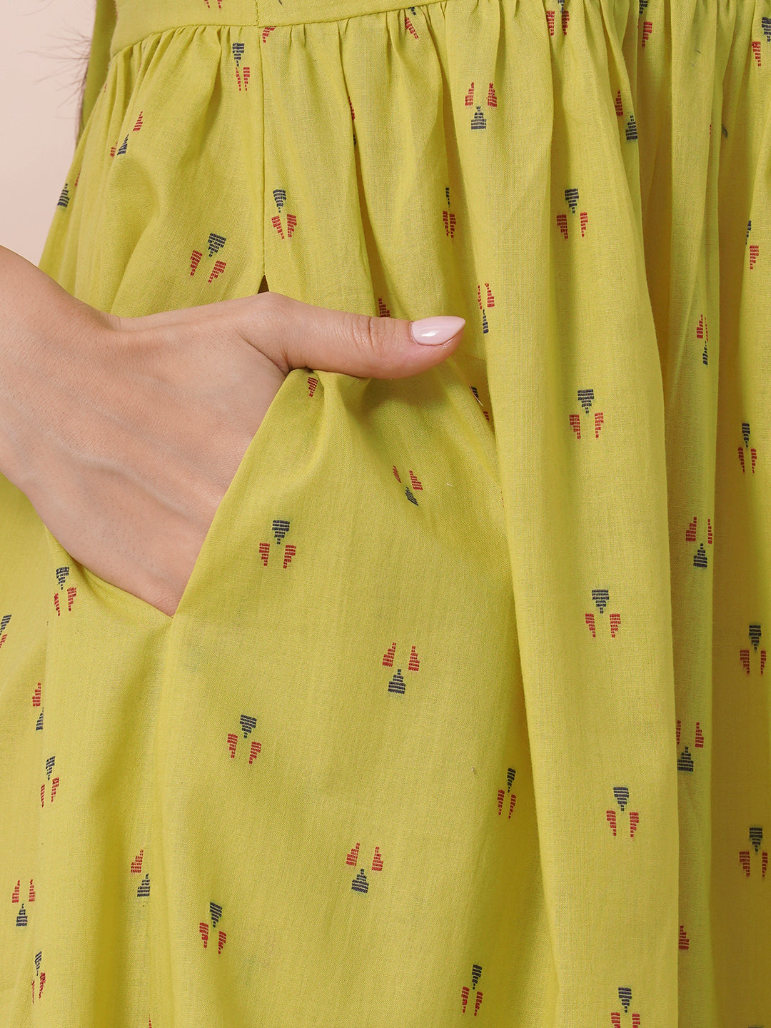 Gathered tiered sleeveless dress with back neck tie-up detailing on dobby fabric.