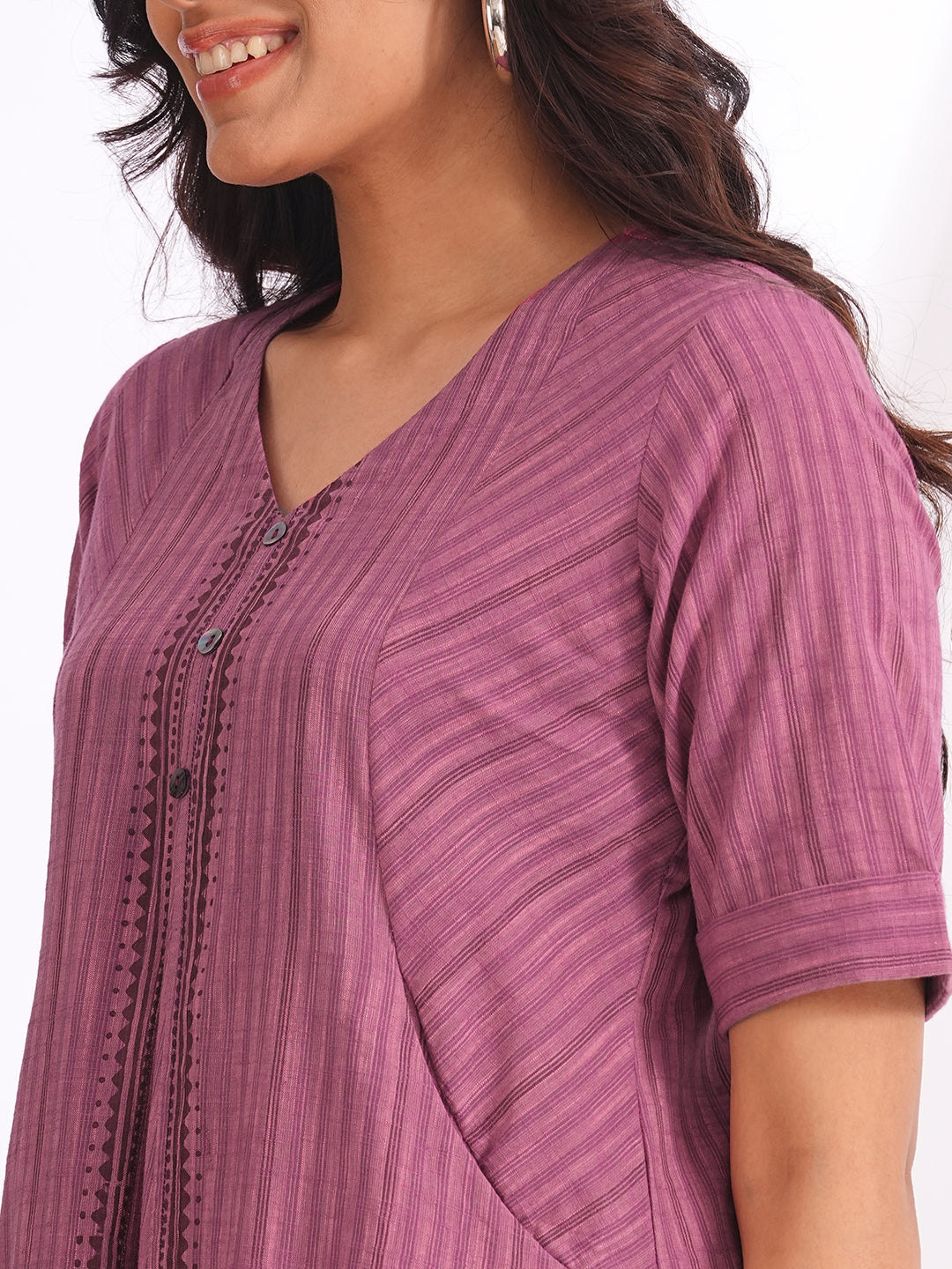 woven striped dress highlighted with block print and shaped side panels with pockets