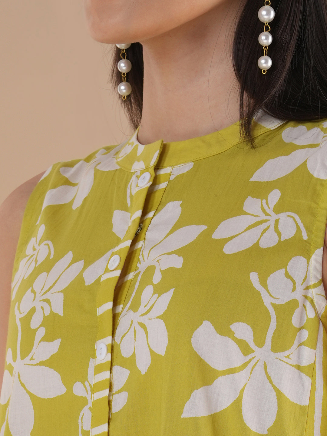 A printed dress with centre placket and pleated side panels with 2 pockets
