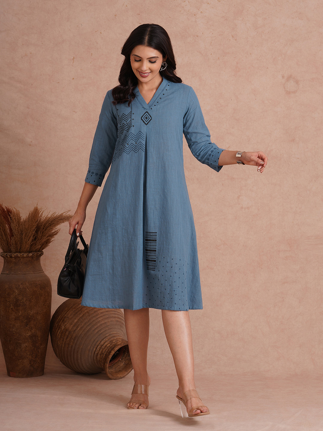 A-line placement block printed dress with centre box pleat in the front and sleeves.