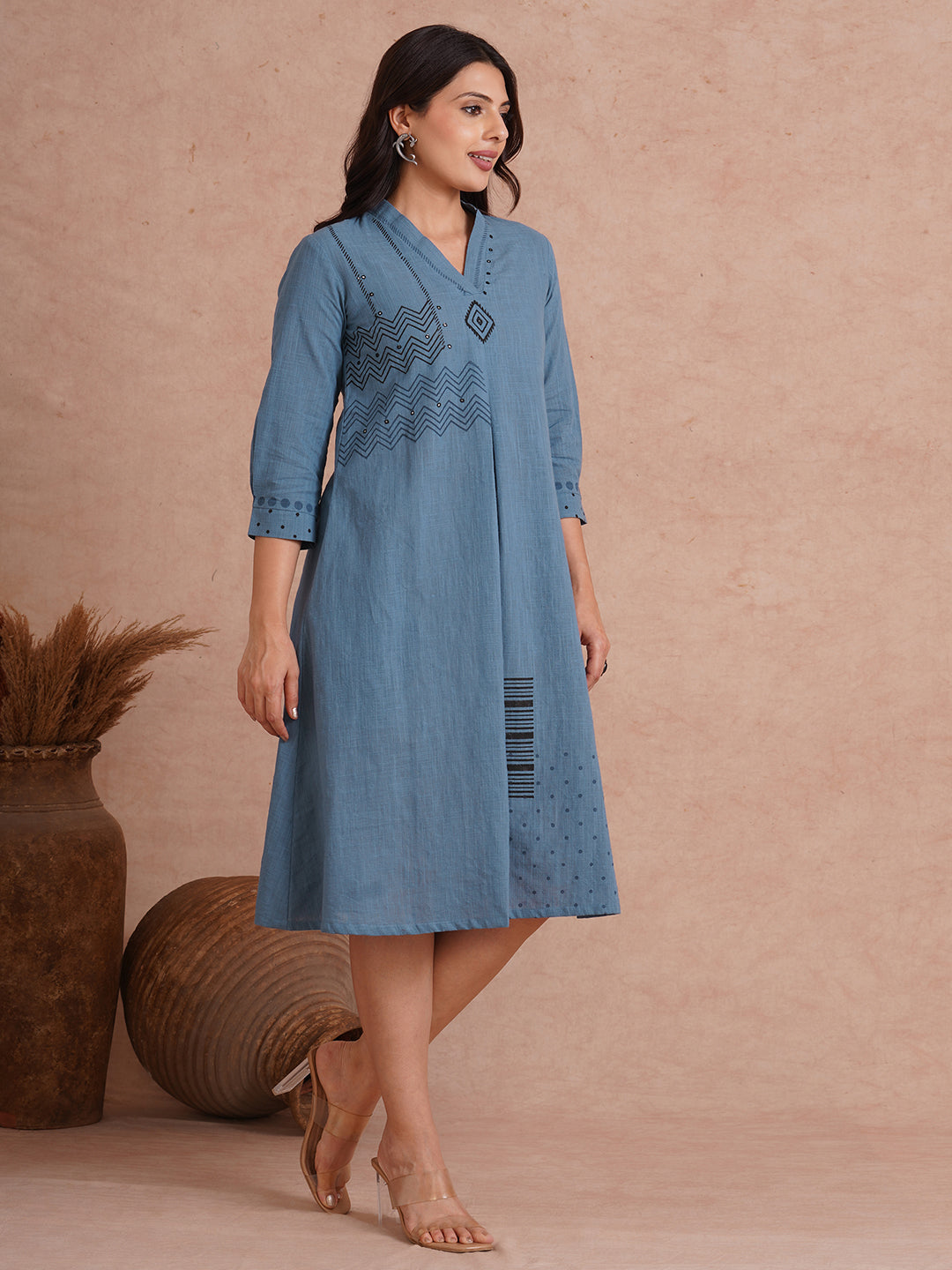 A-line placement block printed dress with centre box pleat in the front and sleeves.