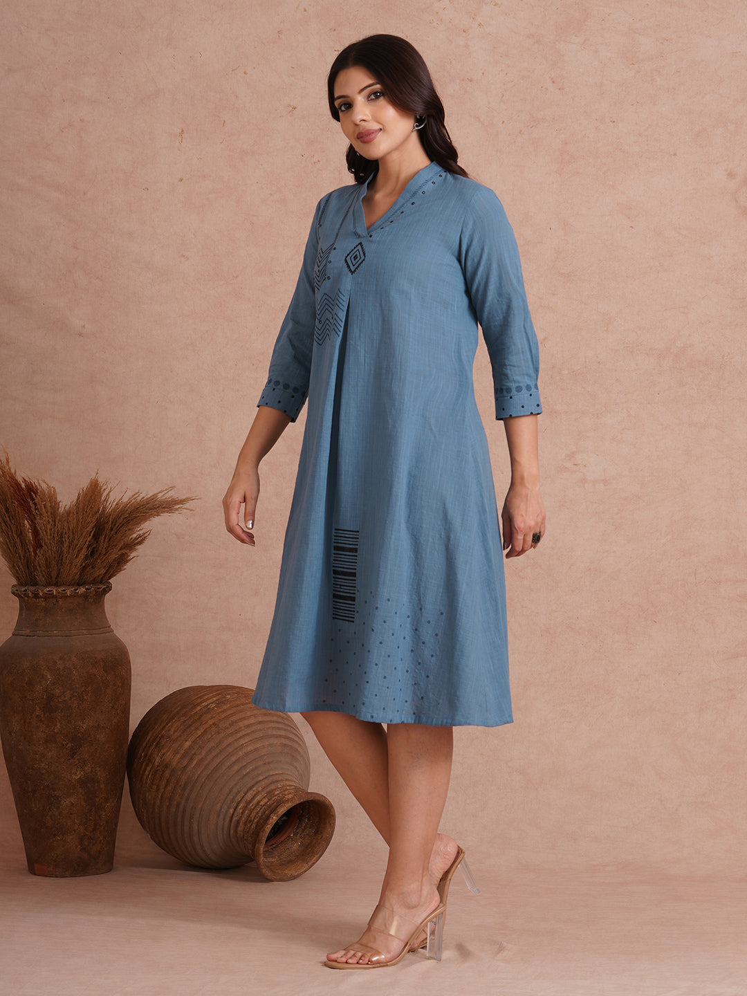 A-line placement block printed dress with centre box pleat in the front and sleeves.