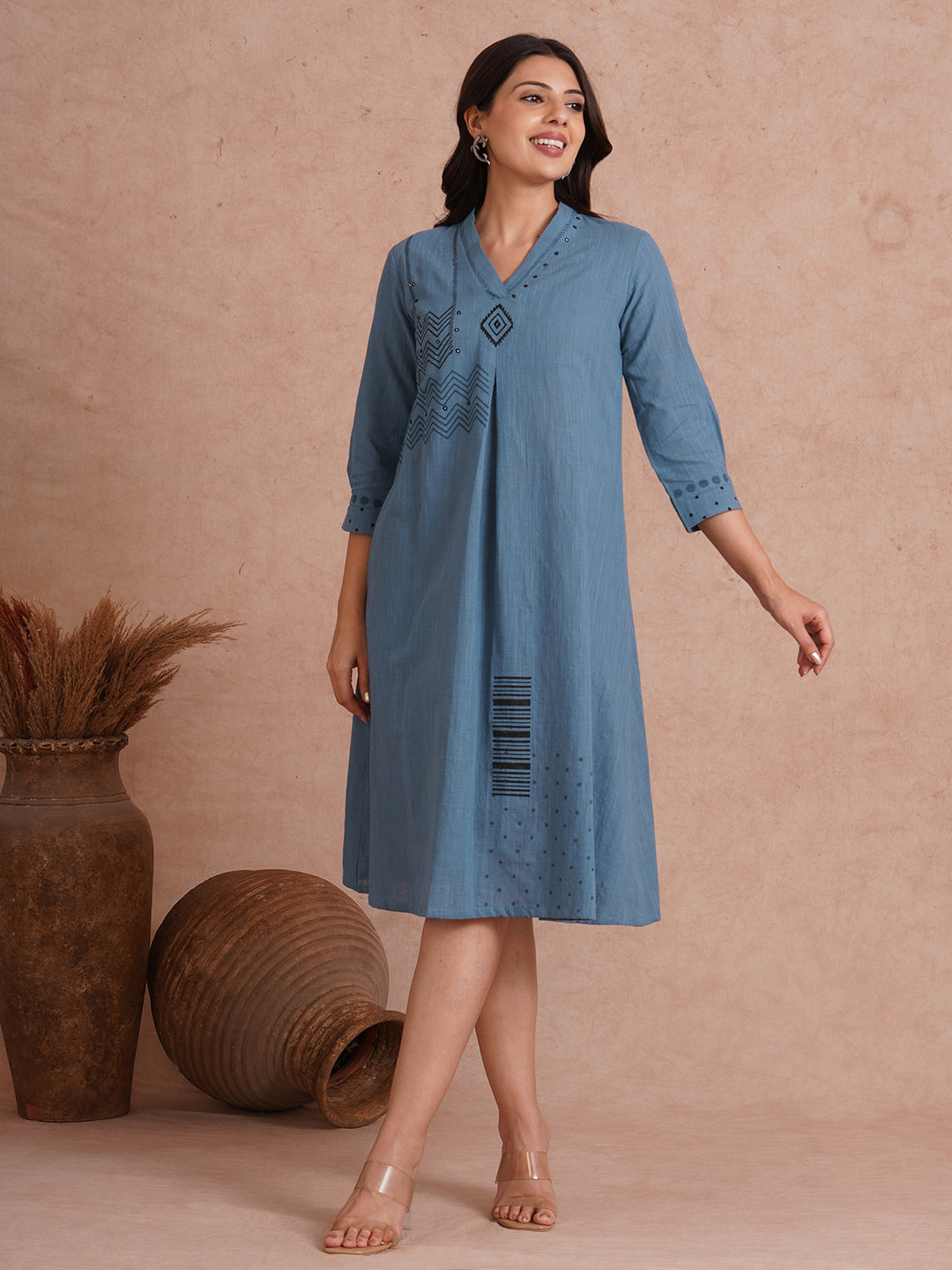 A-line placement block printed dress with centre box pleat in the front and sleeves.