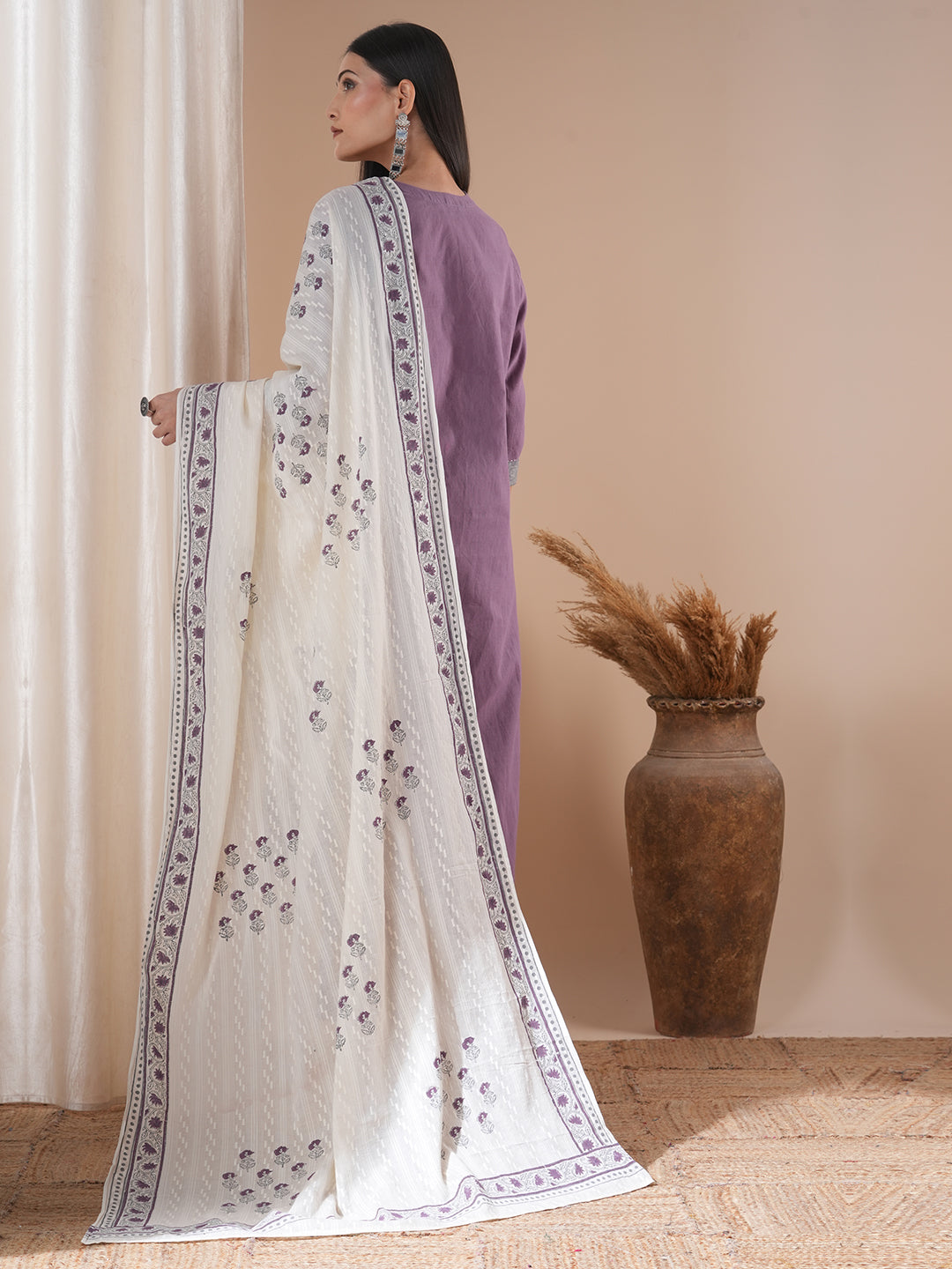 A 3-piece block printed kurta suit set with lace detail and block printed Dupatta