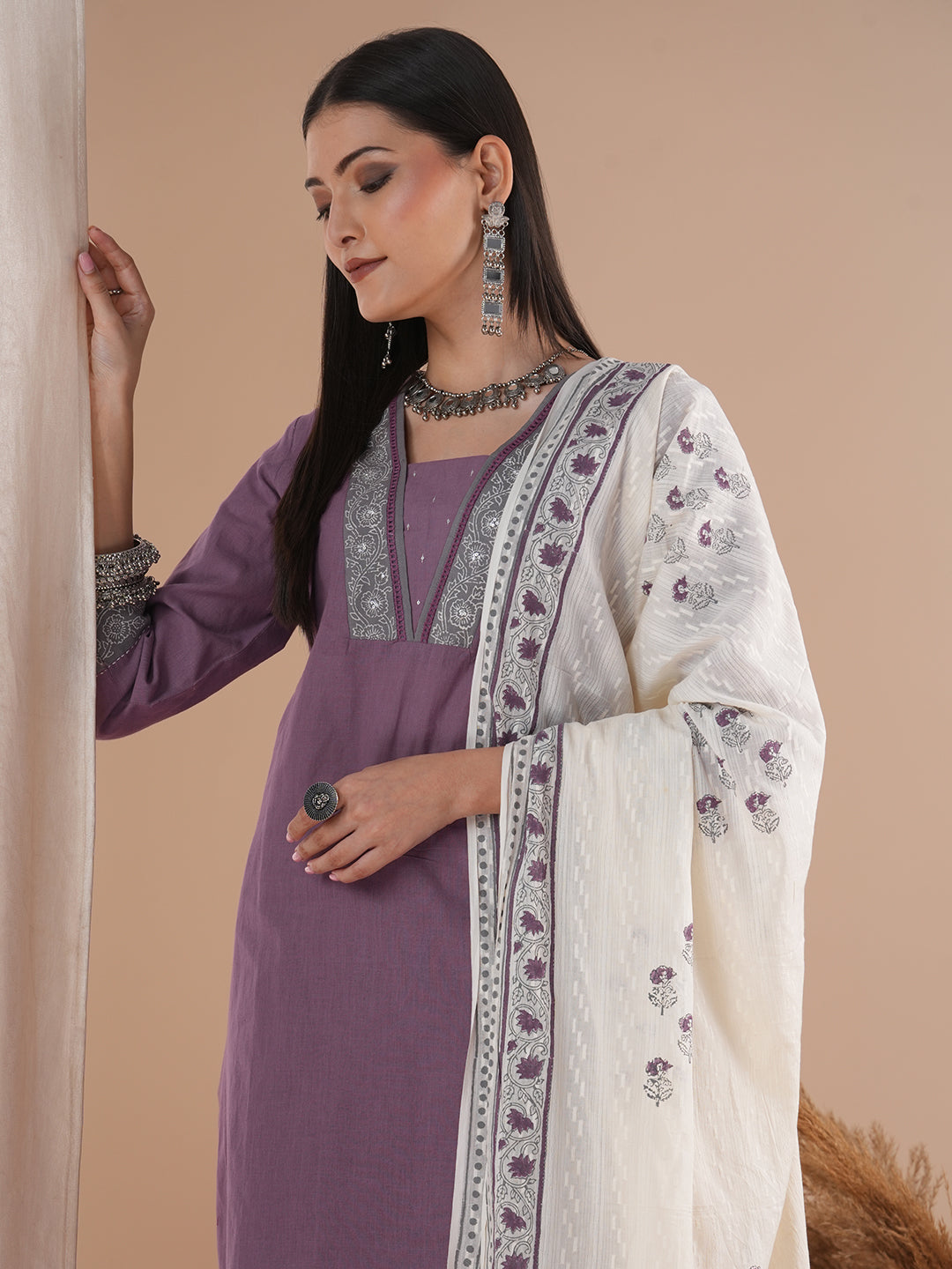 A 3-piece block printed kurta suit set with lace detail and block printed Dupatta