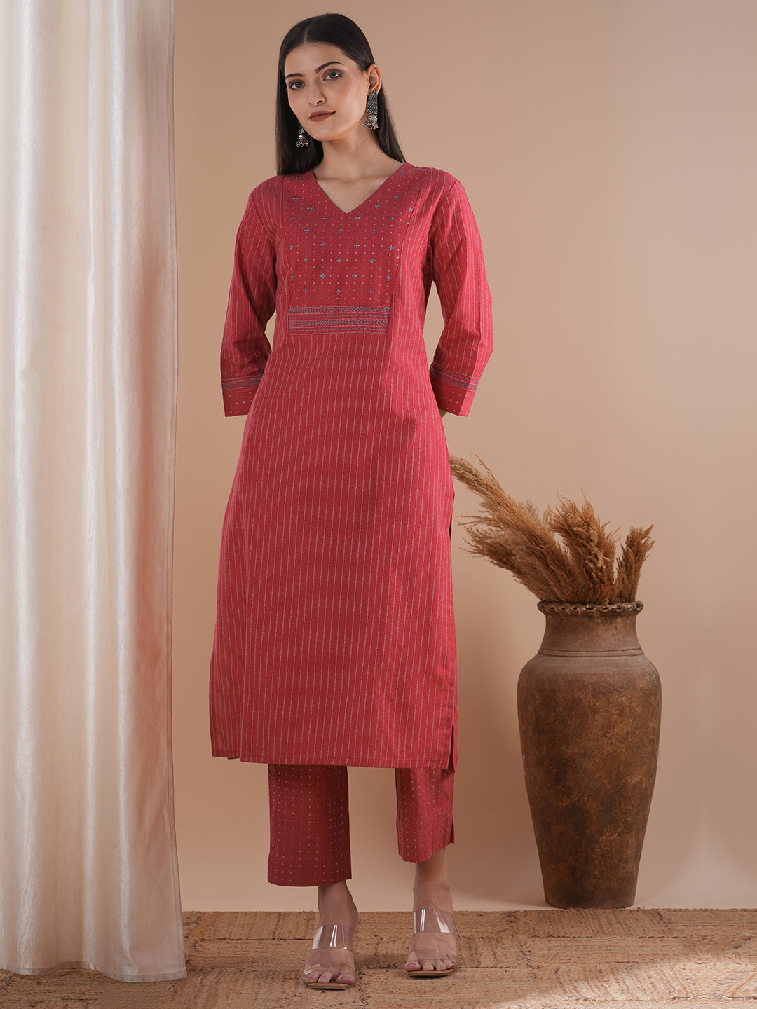 Pink dobby kurta set featuring highlights of contrasting colour embroidery & self bottom