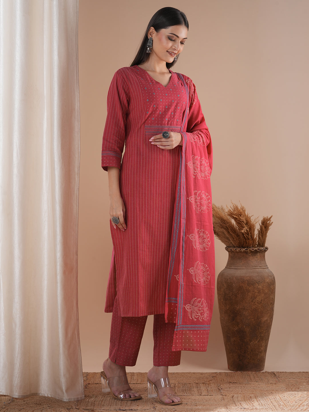 Pink dobby kurta set featuring highlights of contrasting colour embroidery & self bottom