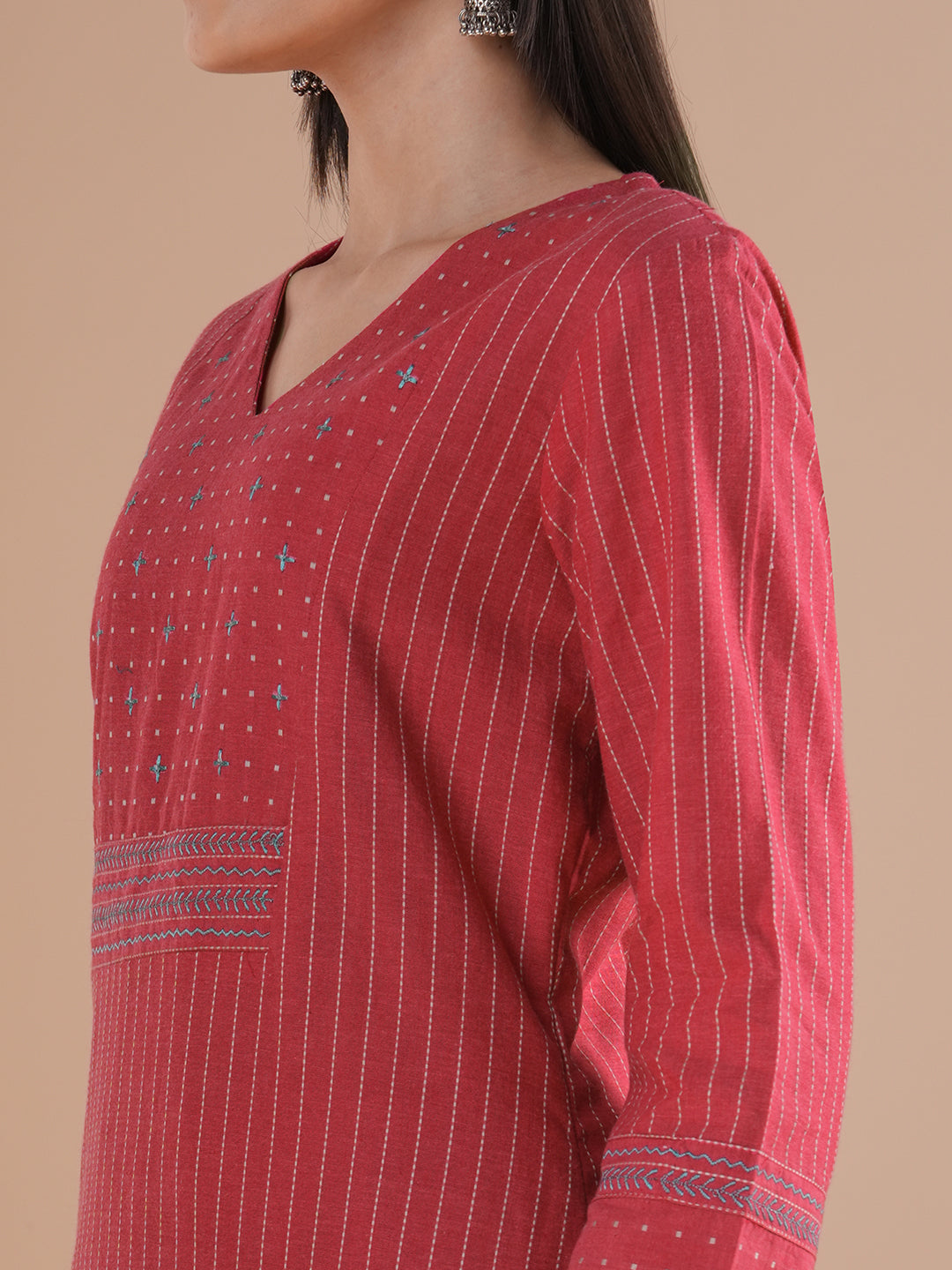 Pink dobby kurta set featuring highlights of contrasting colour embroidery & self bottom