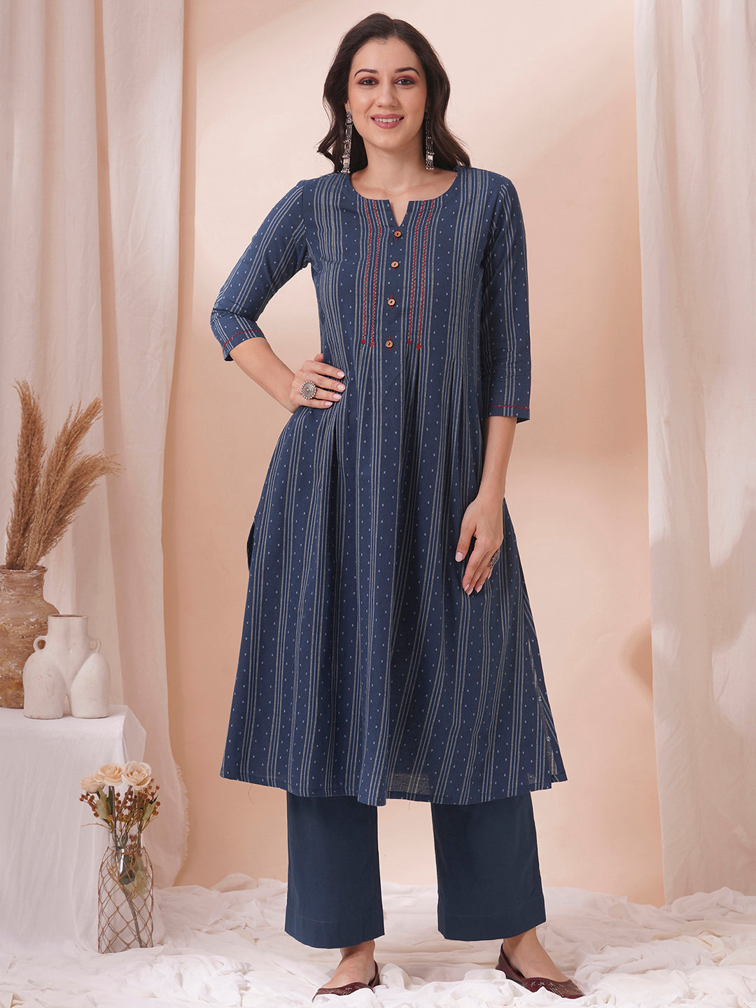 Box pleated dobby kurta in A-Line fit with hand embroidery and pocket.