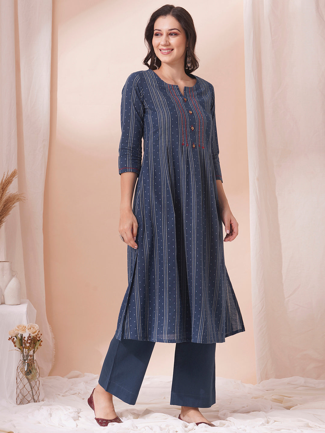 Box pleated dobby kurta in A-Line fit with hand embroidery and pocket.