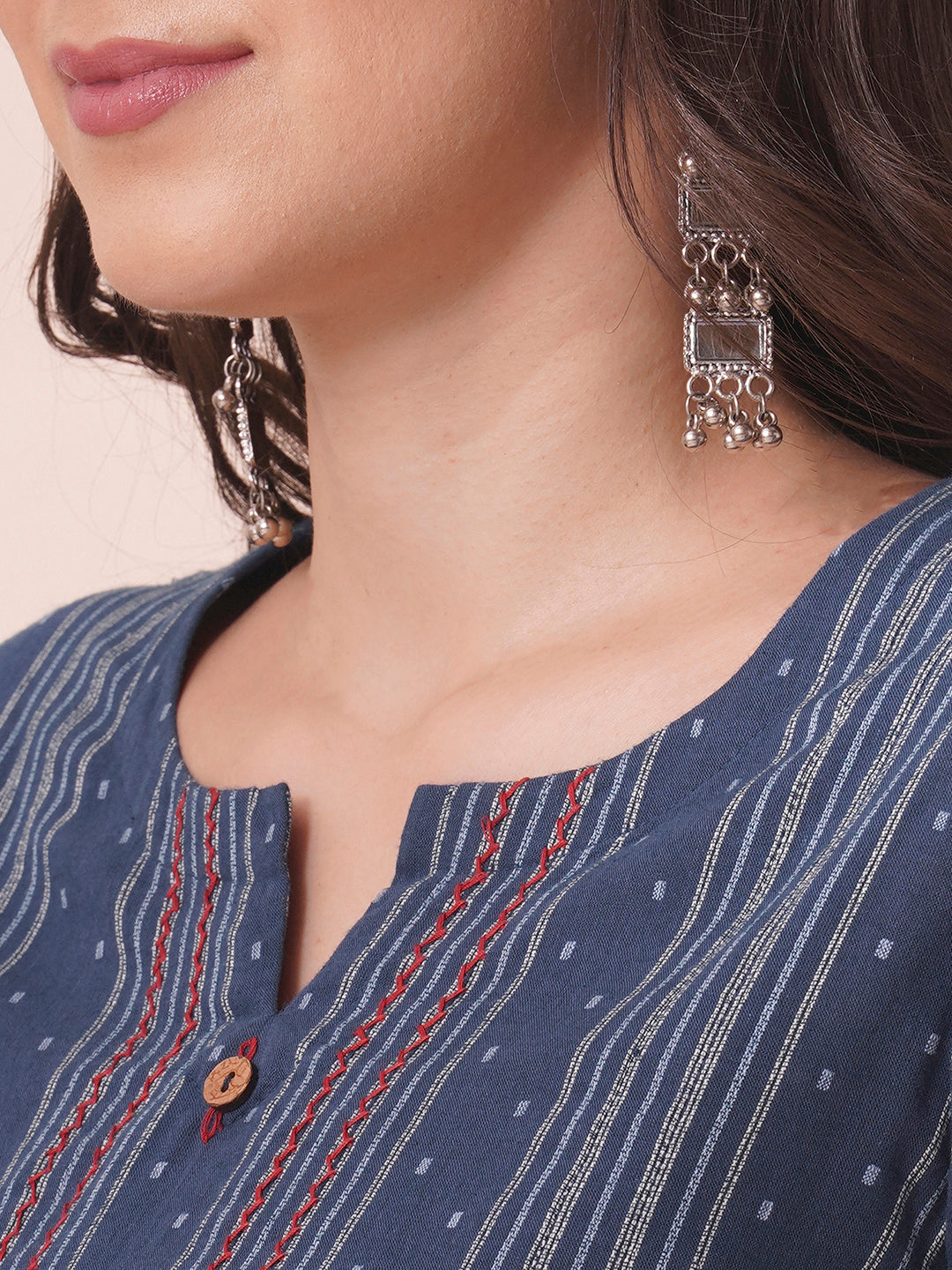 Box pleated dobby kurta in A-Line fit with hand embroidery and pocket.