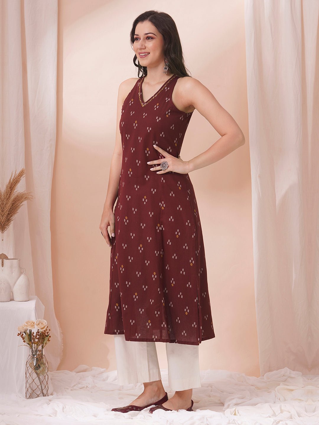 A-Line V-neck kurta in printed cotton flex with hand embroidery.