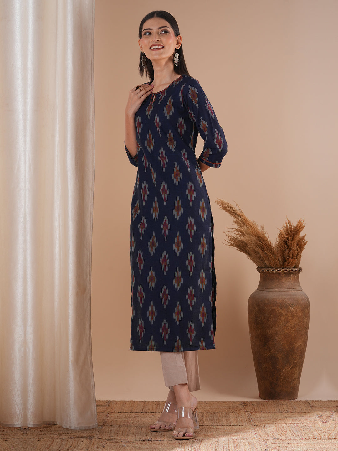 Straight fit cotton kurta in woven ikat fabric with hand embroidery