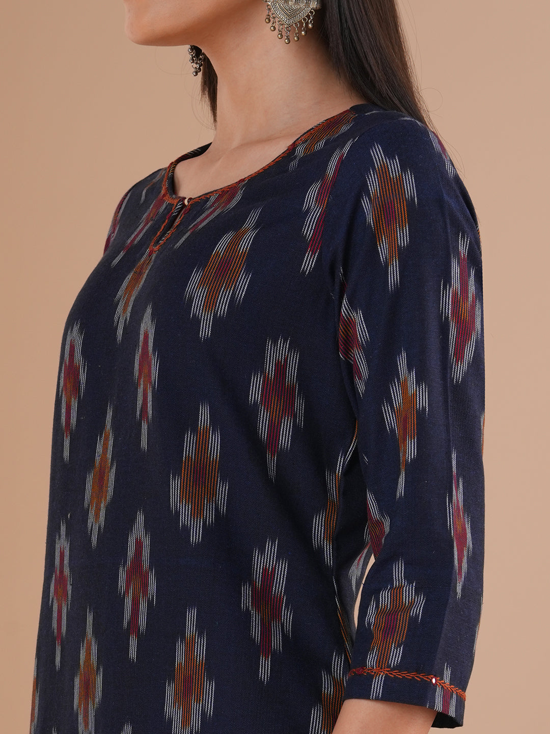 Straight fit cotton kurta in woven ikat fabric with hand embroidery