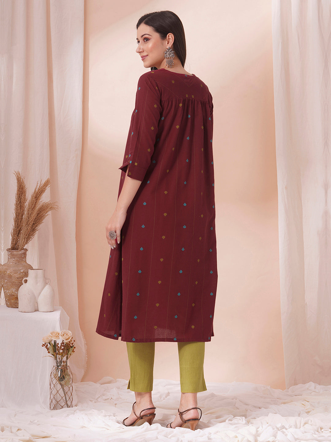 Pocketed cotton dobby kurta with gathering and mirror work.
