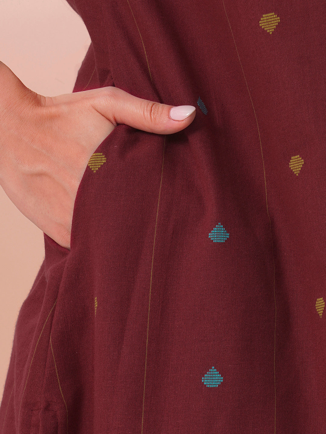 Pocketed cotton dobby kurta with gathering and mirror work.