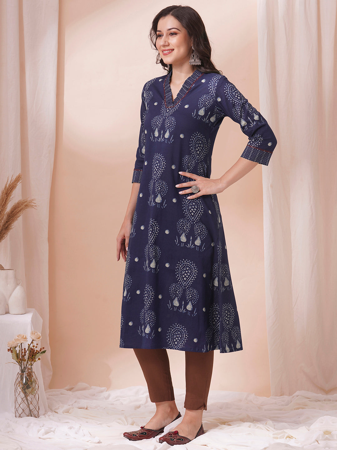 A-line kurta in printed cotton with gathered stripe print on the neckline with handwork.