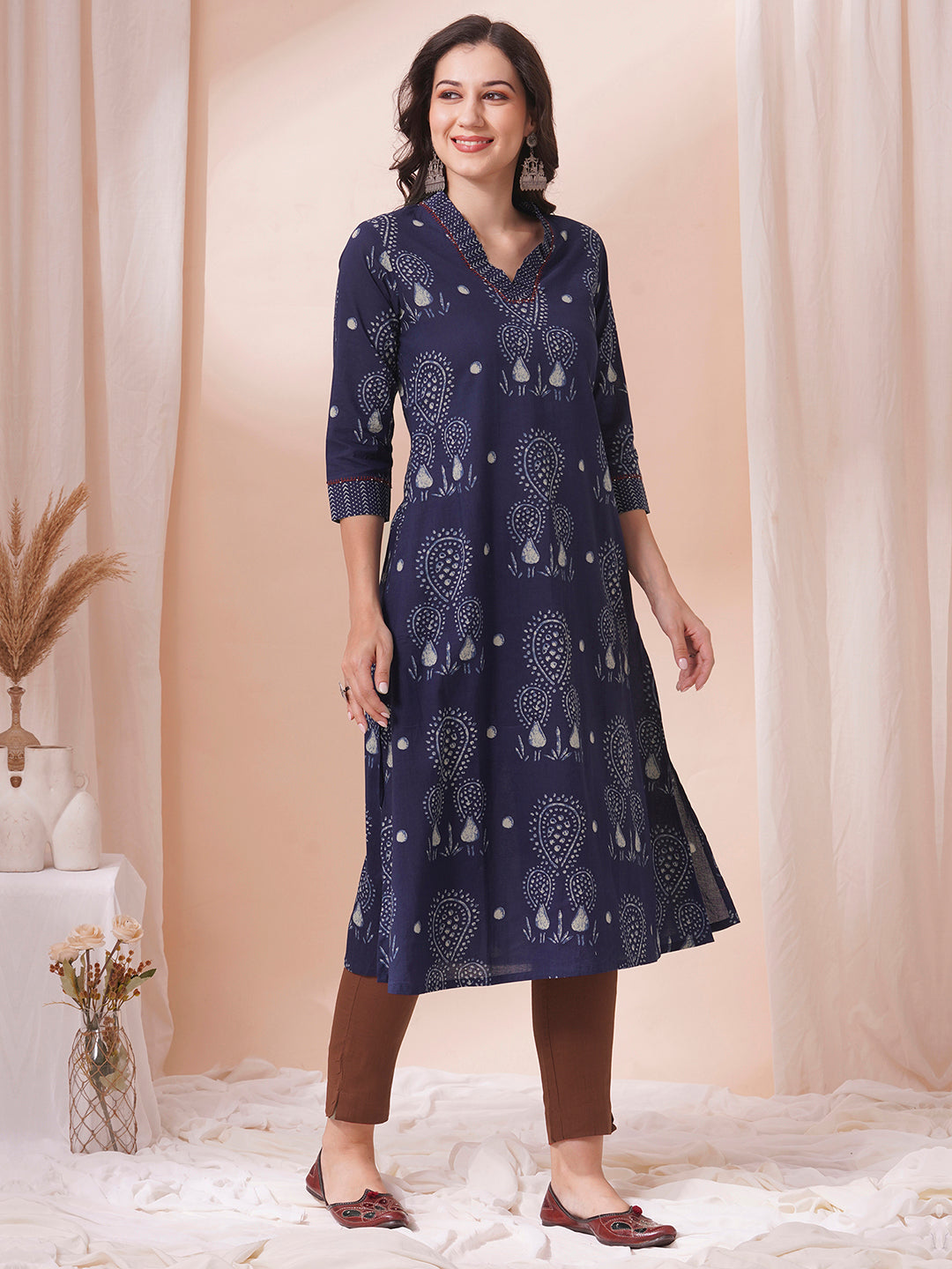 A-line kurta in printed cotton with gathered stripe print on the neckline with handwork.