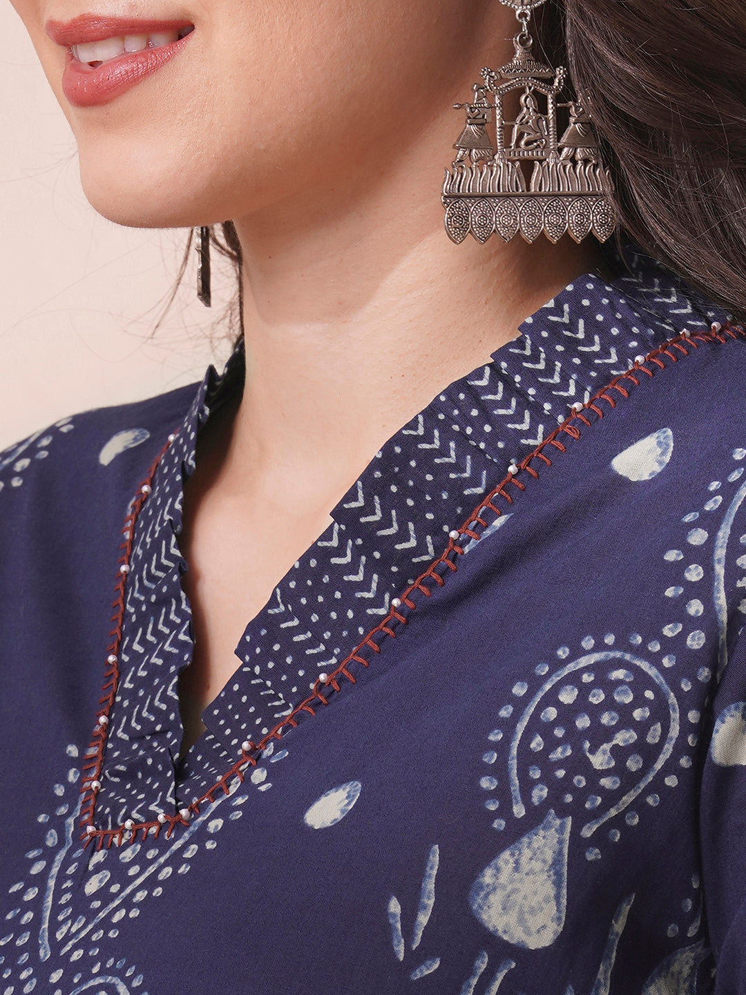 A-line kurta in printed cotton with gathered stripe print on the neckline with handwork.