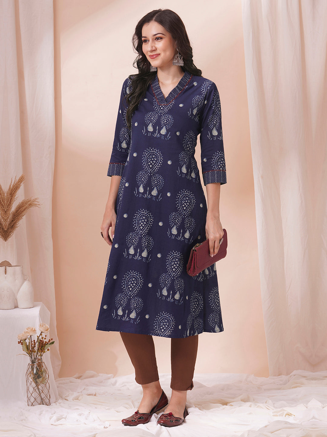 A-line kurta in printed cotton with gathered stripe print on the neckline with handwork.