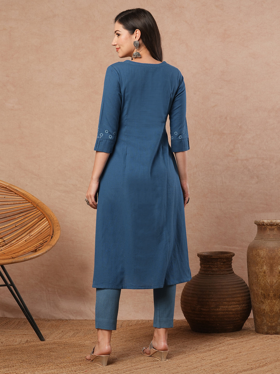 A-line cotton flex kurta with mirror work and attached thread tassels.