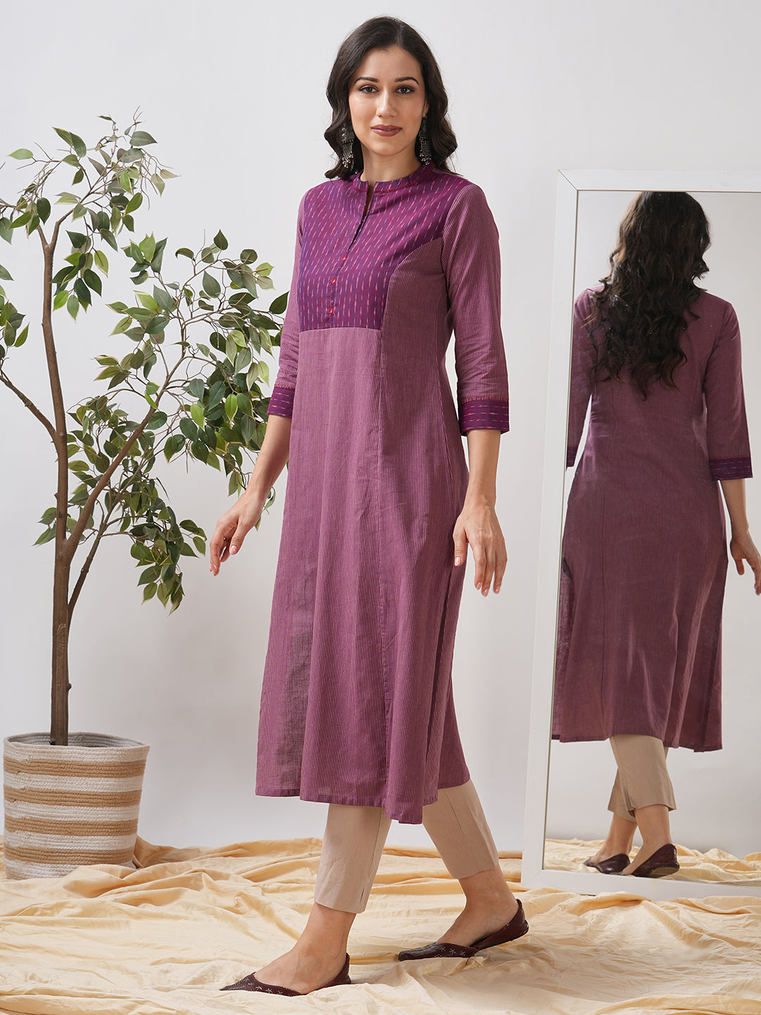 Striped cotton kurta in an A line fit with an ikkat trim and hand embroidery.