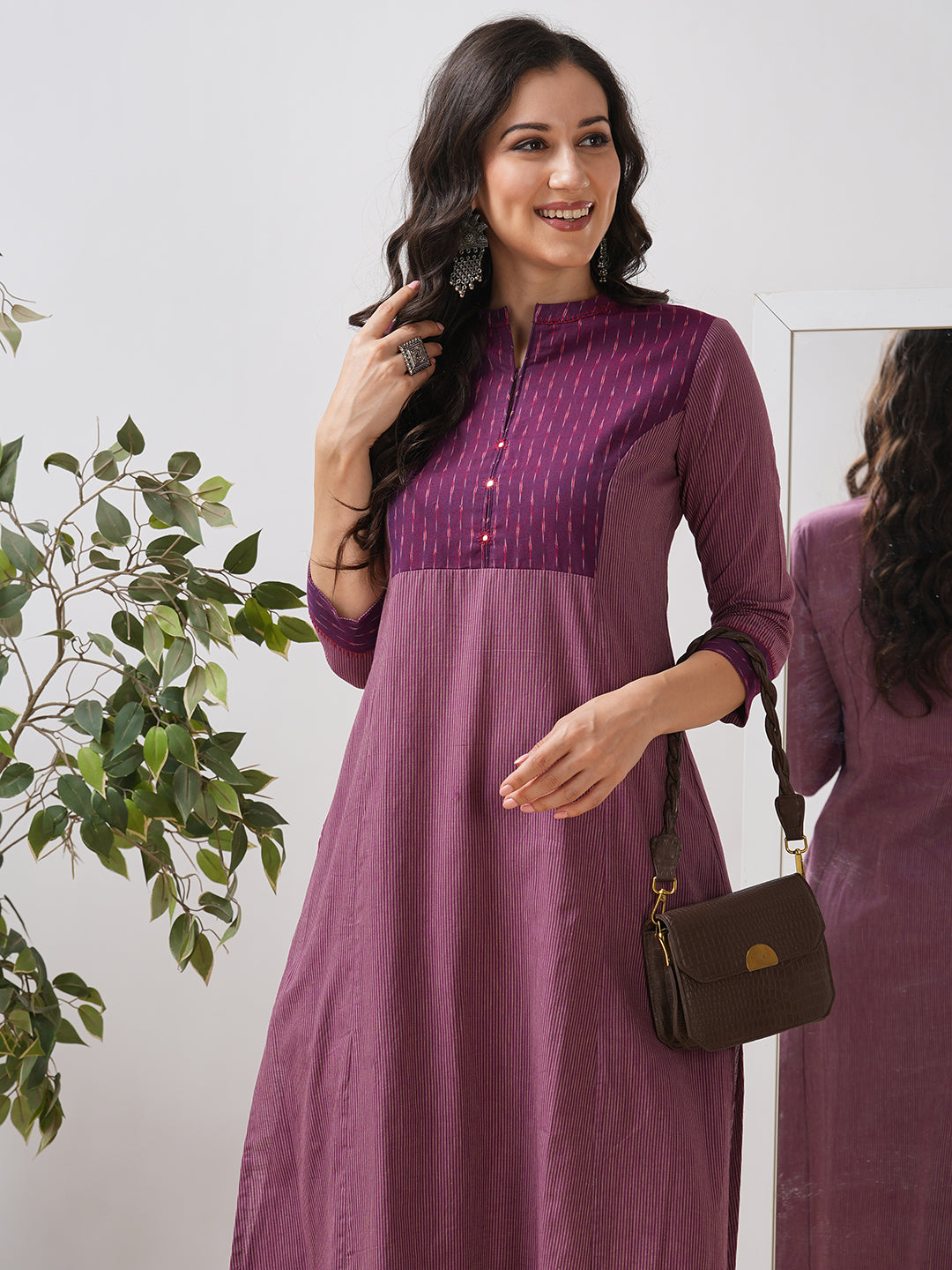Striped cotton kurta in an A line fit with an ikkat trim and hand embroidery.