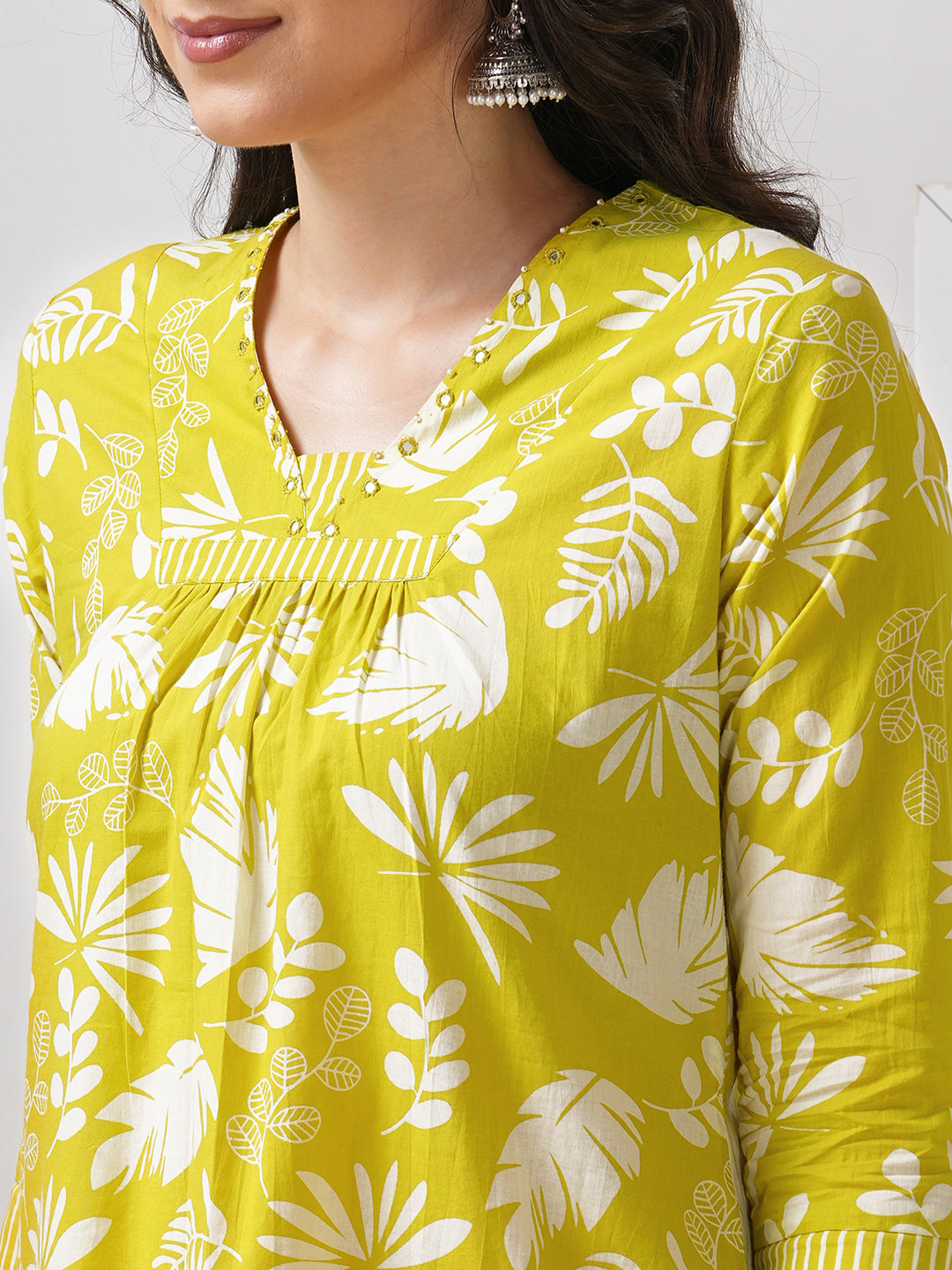 Gathered A line kurta in printed cotton fabric with hand embroidery and pocket.