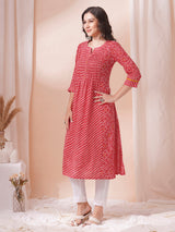 Red Pleated cotton print kurta in an A-Line fit with hand embroidery and pocket.
