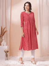 Red Pleated cotton print kurta in an A-Line fit with hand embroidery and pocket.
