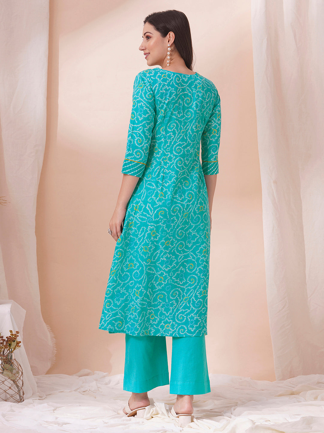 A-line bandhani print kurta with embroidery and cutwork detailing on the a zone and sleeve.