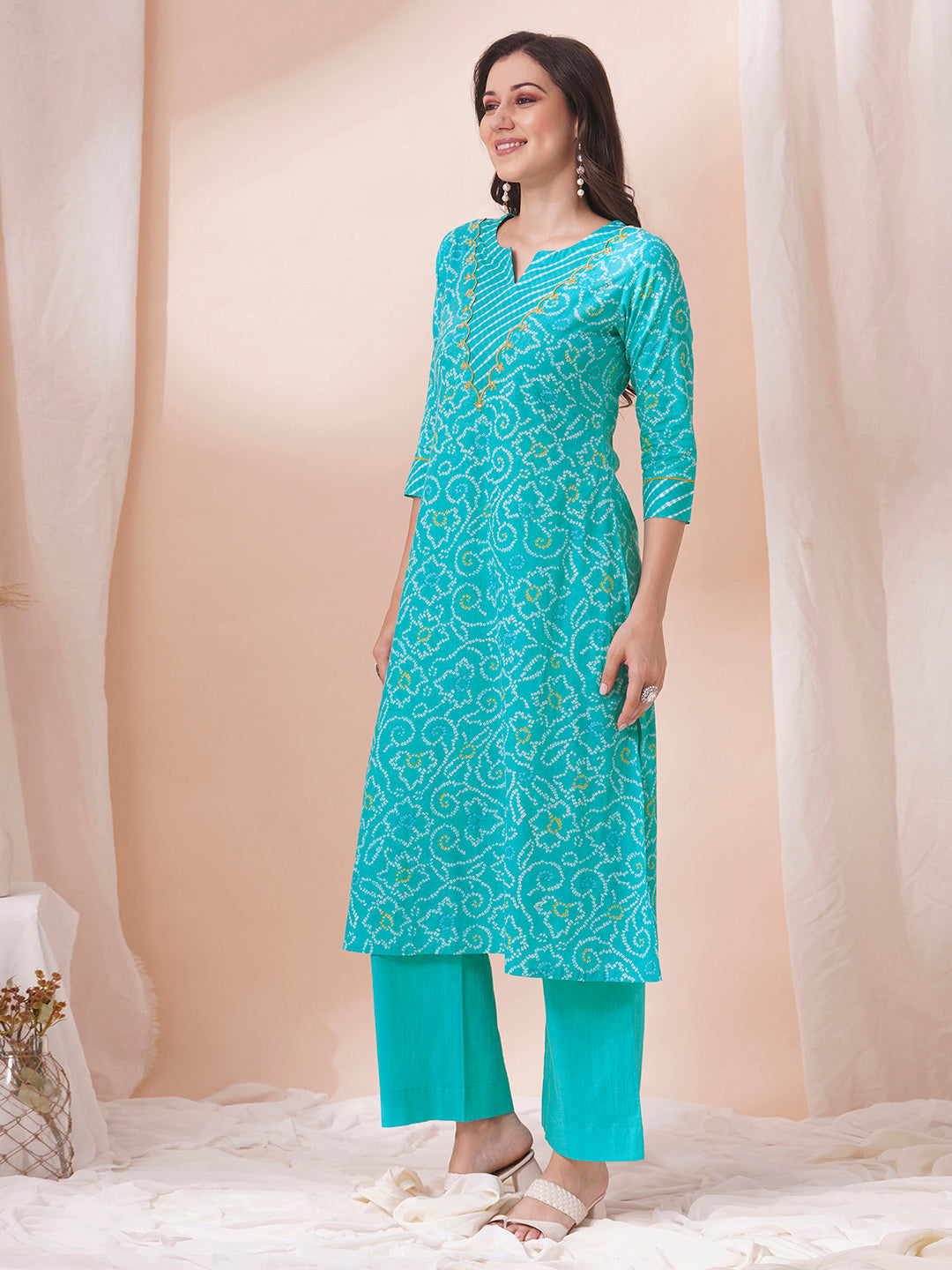 A-line bandhani print kurta with embroidery and cutwork detailing on the a zone and sleeve.