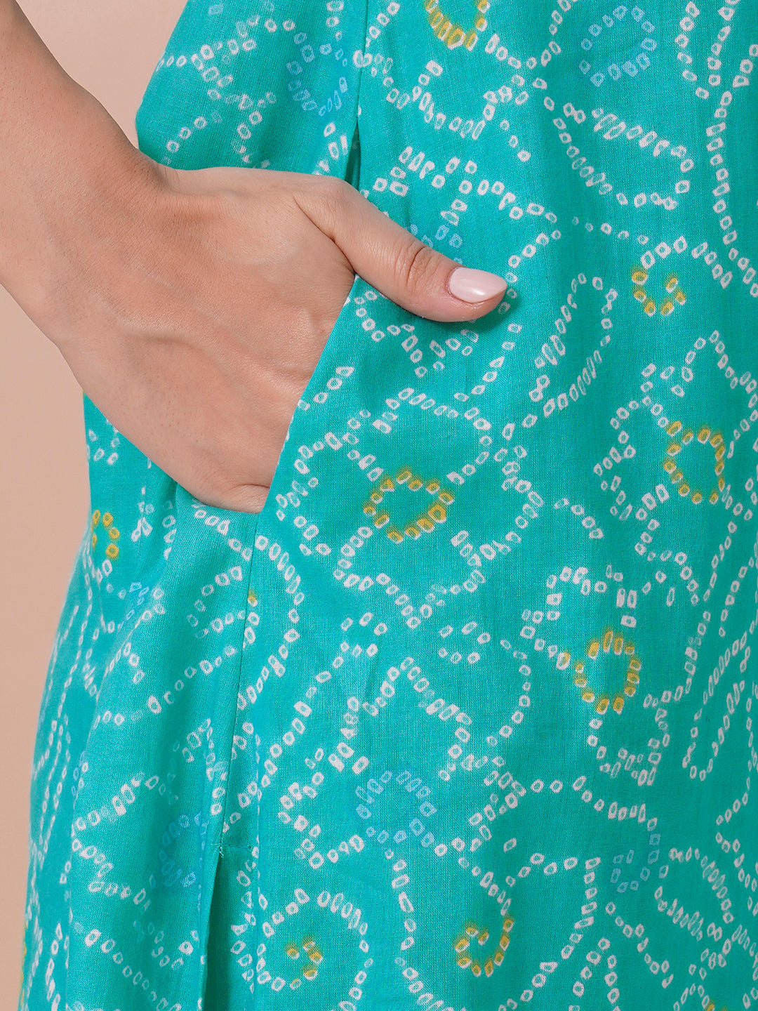 A-line bandhani print kurta with embroidery and cutwork detailing on the a zone and sleeve.