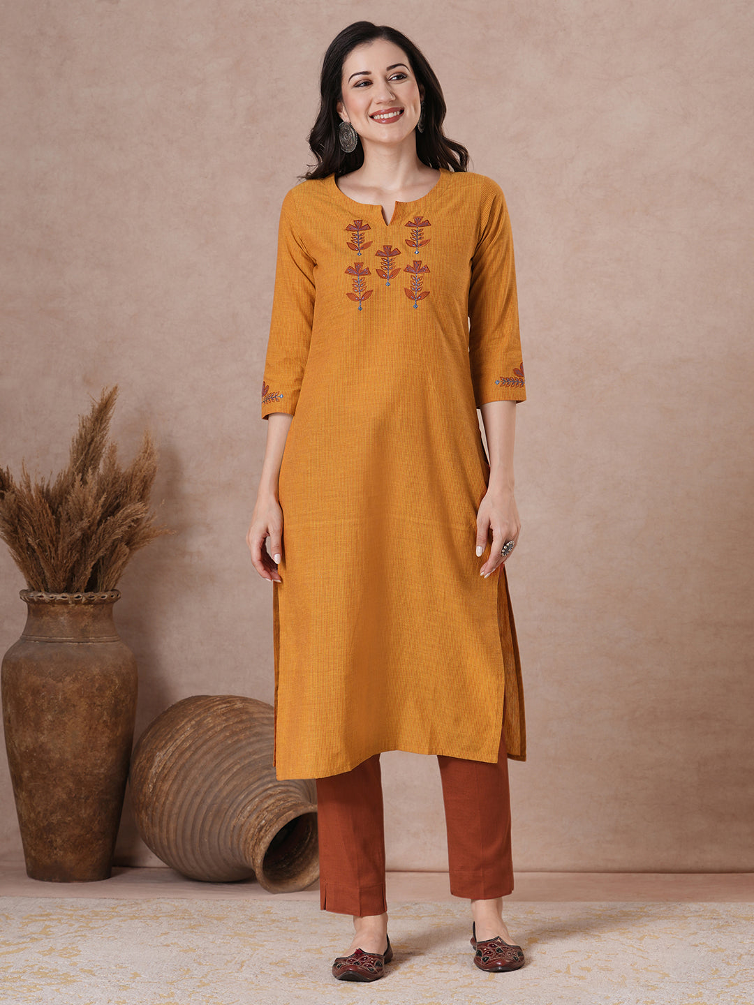 Embroidered straight fit kurta in checkered cotton fabric.