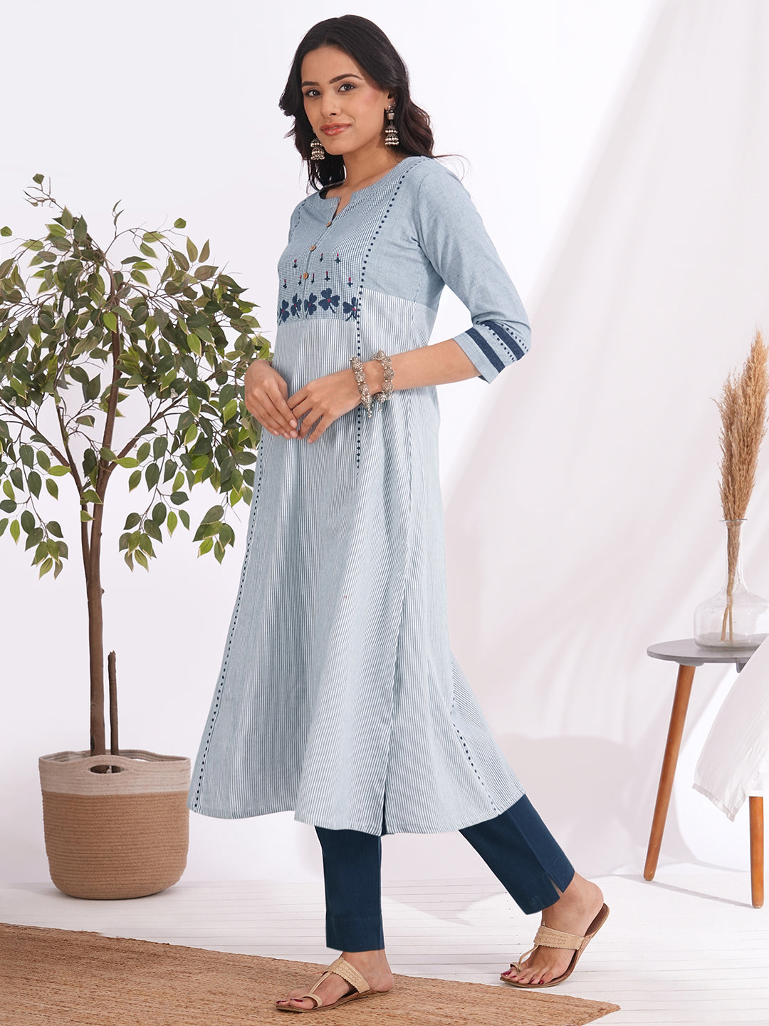 Pocketed A-line kurta in woven cotton fabric with block print and hand embroidery