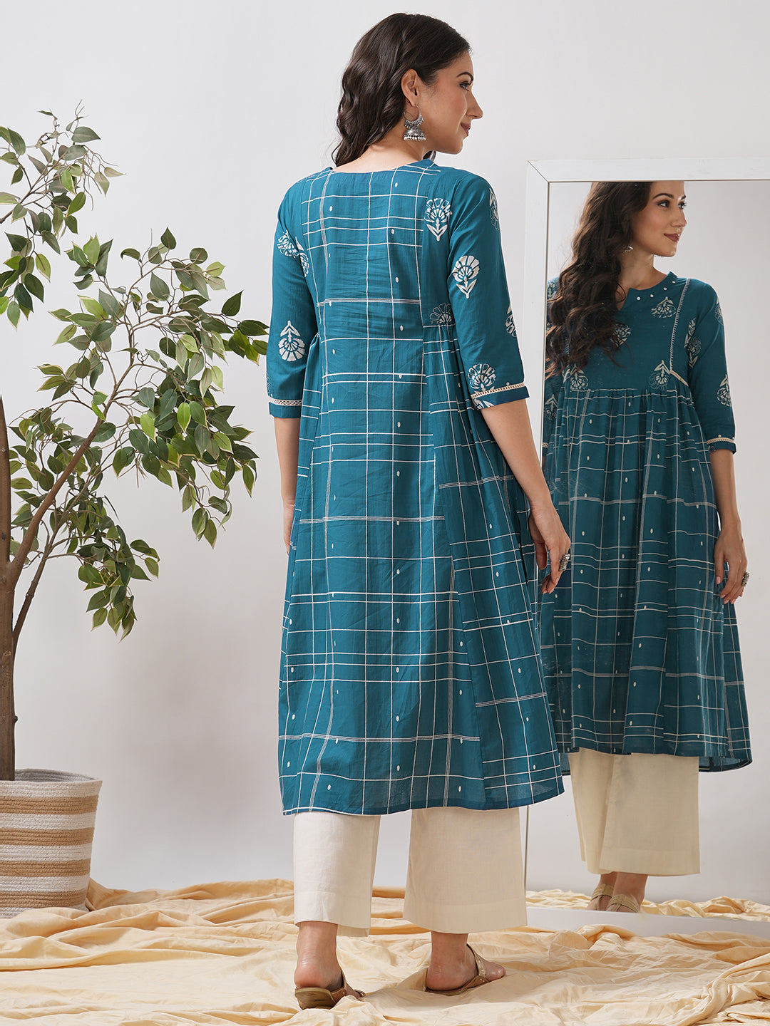 Pocketed A line kurta highlighted with lace, gathering and mirror work.