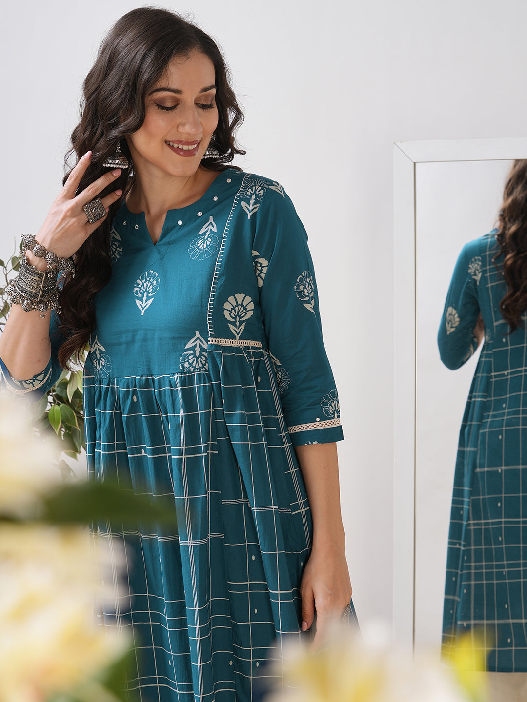 Pocketed A line kurta highlighted with lace, gathering and mirror work.